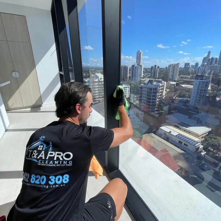 T and A Pro Cleaning completing scheduled high-rise window maintenance