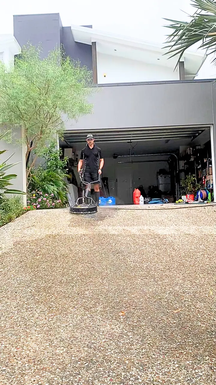T and A Pro Cleaning technician operating professional pressure-cleaning equipment